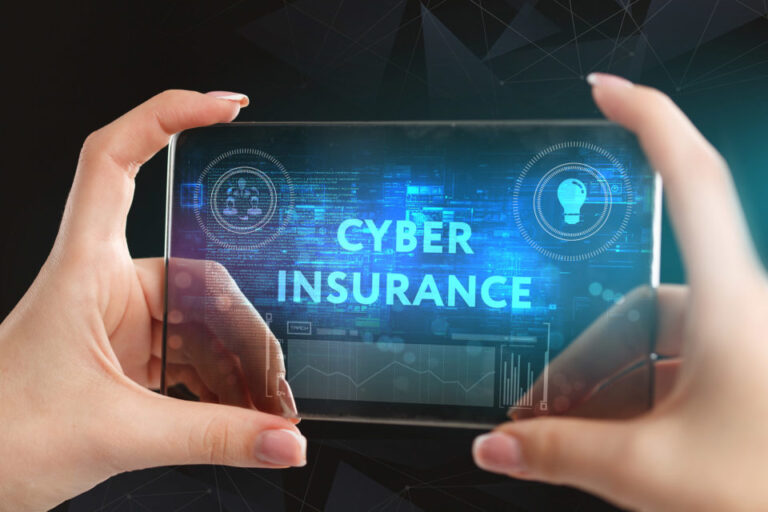 Person holding a transparent digital screen displaying the words “Cybersecurity Insurance,” symbolizing online security protection and risk management.