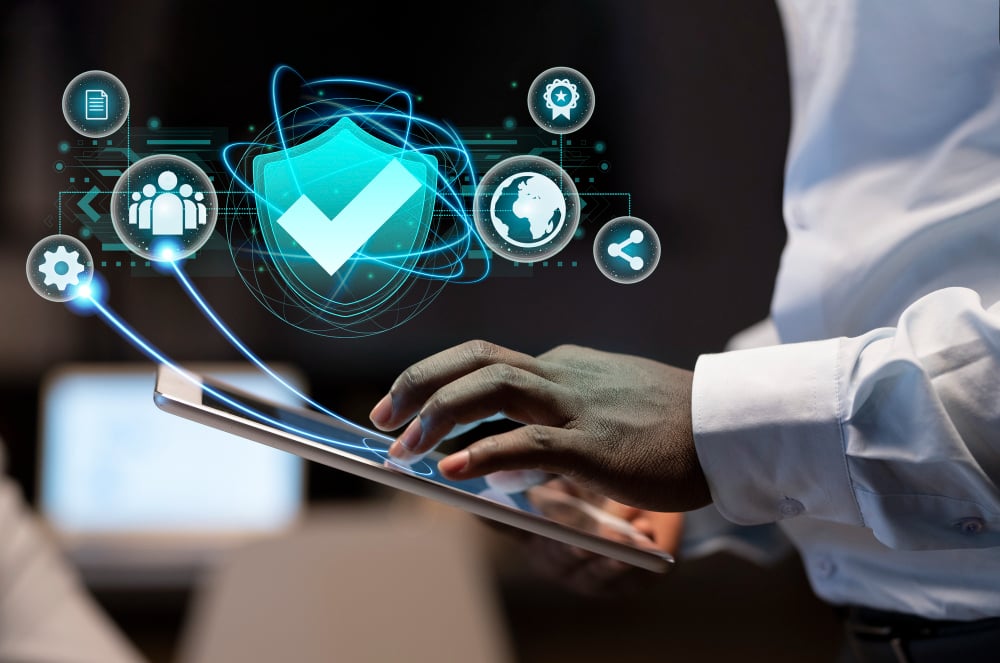 IT technician monitoring a dashboard displaying AI-powered cybersecurity and network analytics as part of managed IT services with AI
