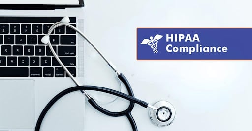 Laptop with a stethoscope next to a sign reading HIPAA Compliance, symbolizing how healthcare professionals can stay HIPAA compliant using secure technology.