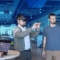 Group of people using augmented reality and digital collaboration tools in a modern tech workspace IT services.