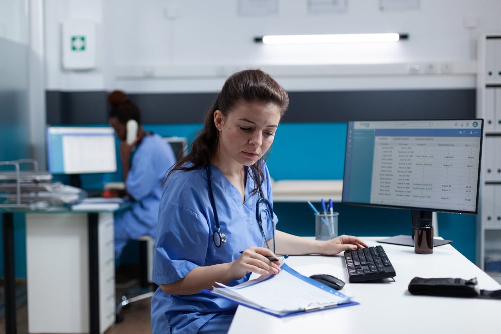 Medical office staff handling appointments manually during an IT outage