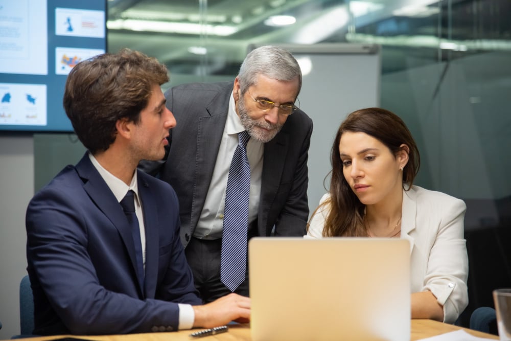 Managed IT services team reviewing support and security dashboard with business leadership